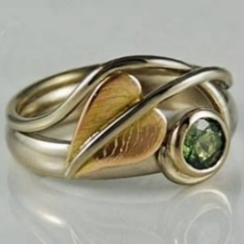 Bicolor Curved Leaf Ring with Green Synthetic Zirconia